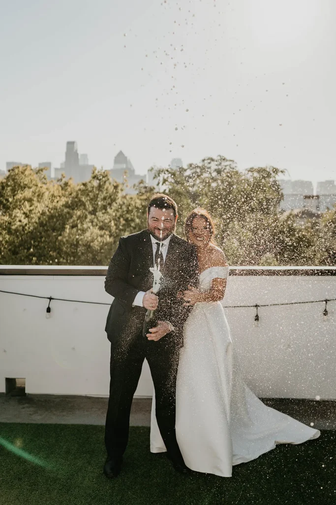 Bride and groom celebrating on a rooftop at their wedding